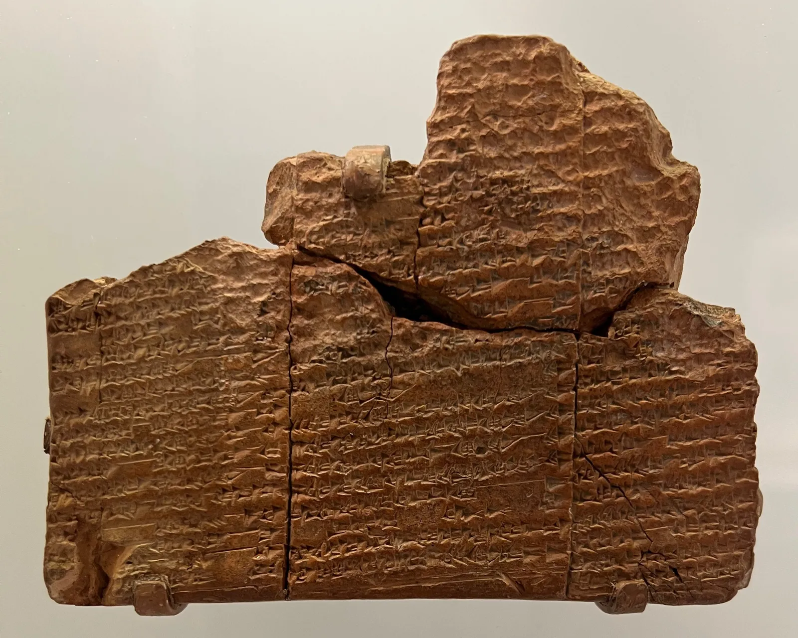 The Sumerian Flood Story tablet: a reddish clay tablet in joined fragments, covered with cuneiform